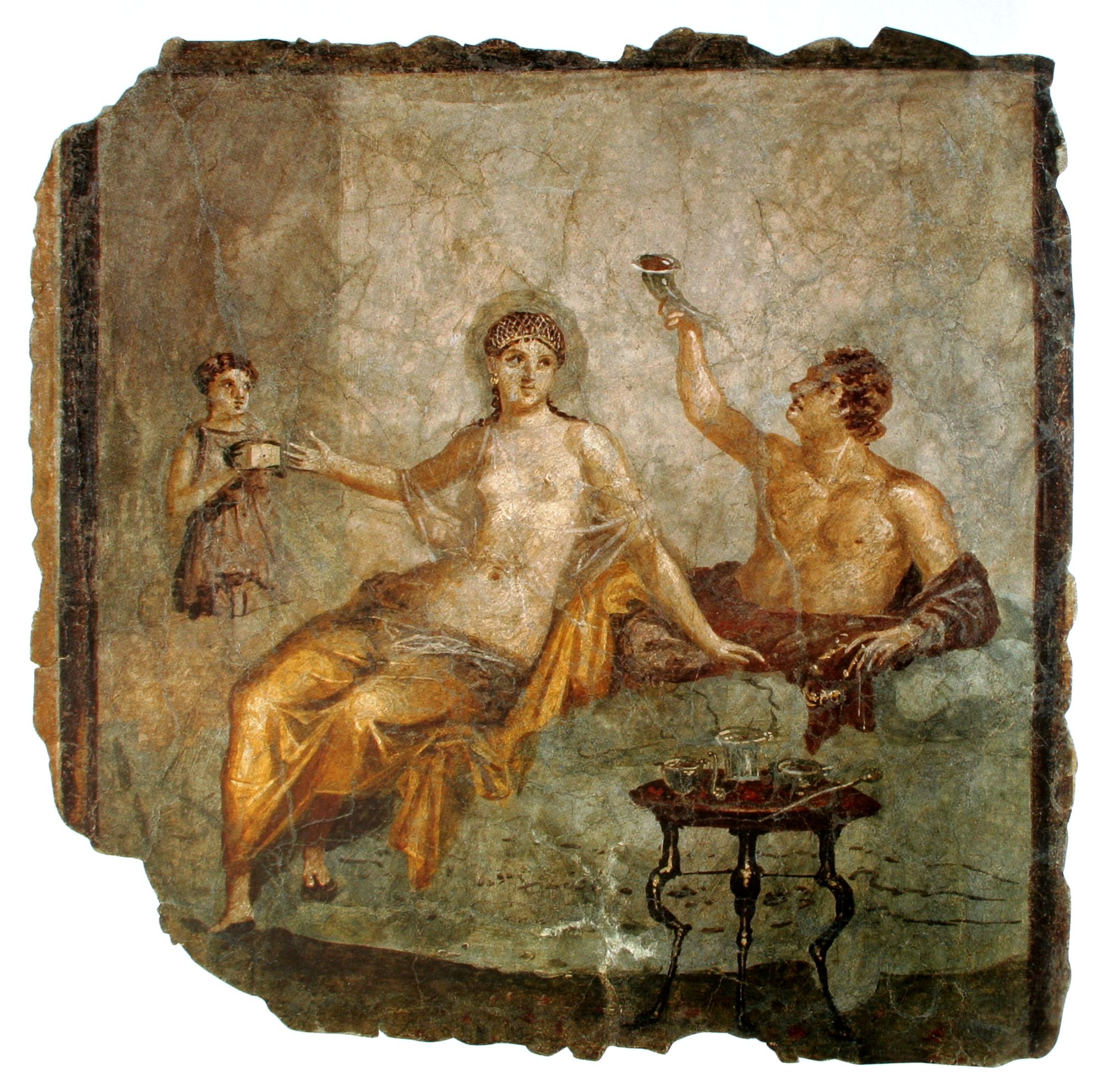 A late Roman-Republican banquet scene in a fresco from Herculaneum, Italy. 59 x 53 cm. The woman wears a transparent silk gown while the man to the left raises a rhyton drinking vessel.